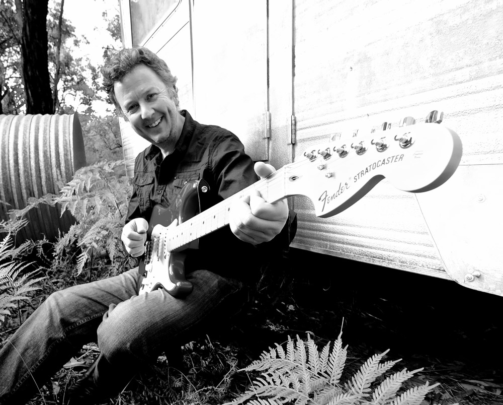 Patrick Shawcross portrait with guitar